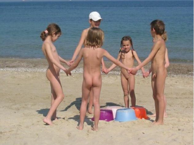 Nudists children on a beach