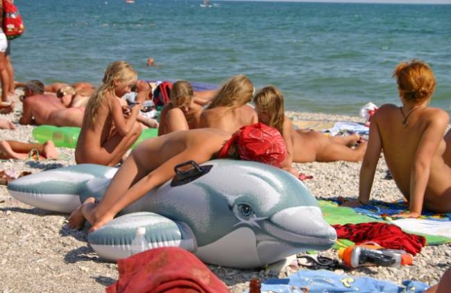 On a nudist beach bare families