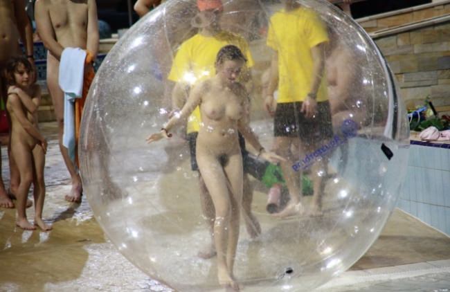 Nudists mark a holiday in the pool