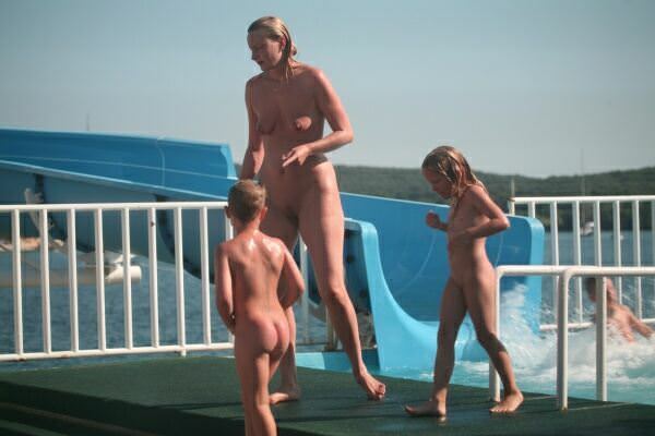 Photos about a family nudism in an aquapark