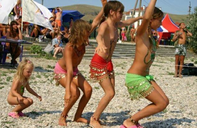 Family nudism of a photo - competition of dances of young nudists