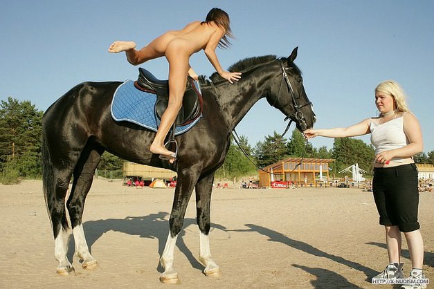 Young nudists in nature learn to ride on horseback video